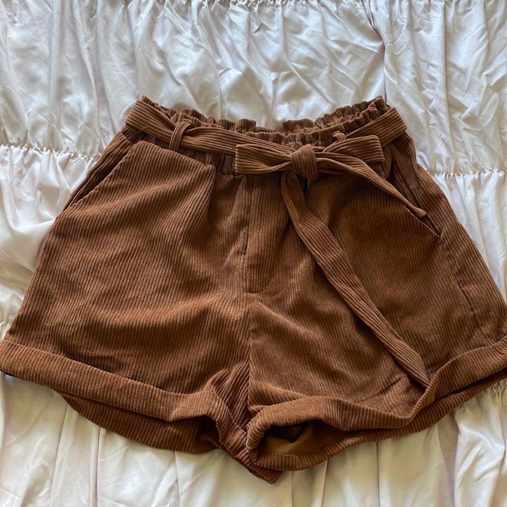 Brand is by Shein, brown corduroy shorts and its a size M